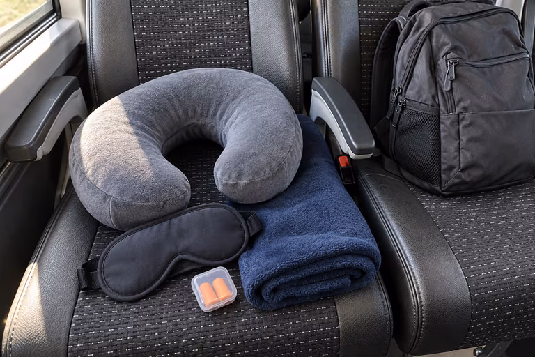 three bring a travel pillow an eye mask and earplugs