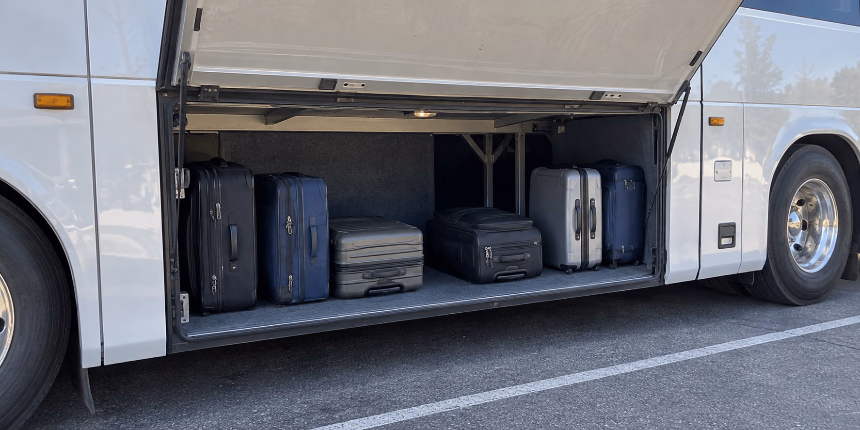 charter bus hundreds of cubic feet of luggage below the floor