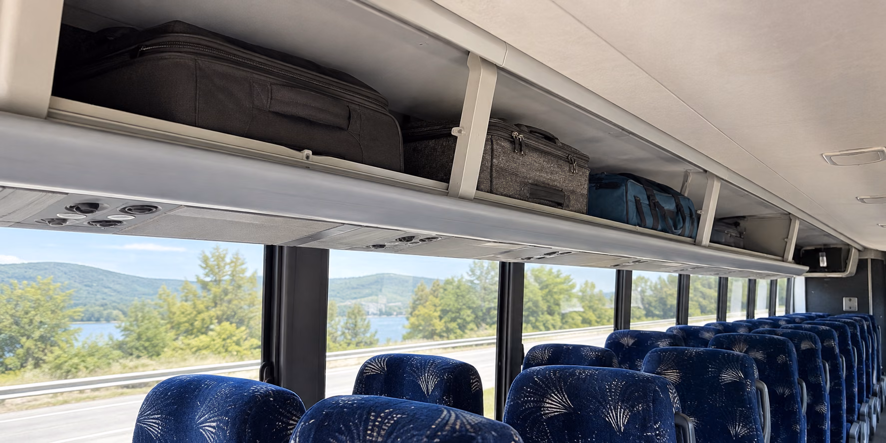 charter bus overhead storage above every row